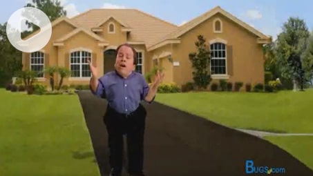Greg price standing outside of a large home.