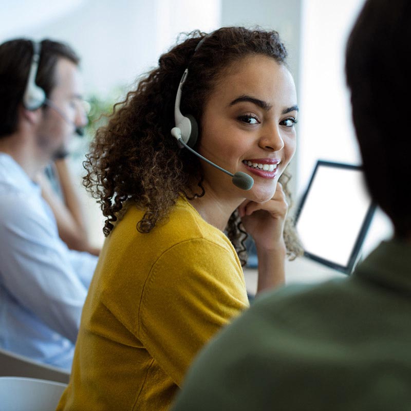 A service rep wearing a headset.