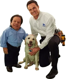 Greg Rice and Adam Douglas with a dog.