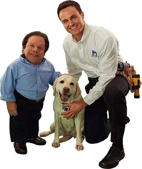 Greg Rice and Adam Douglas with a dog.